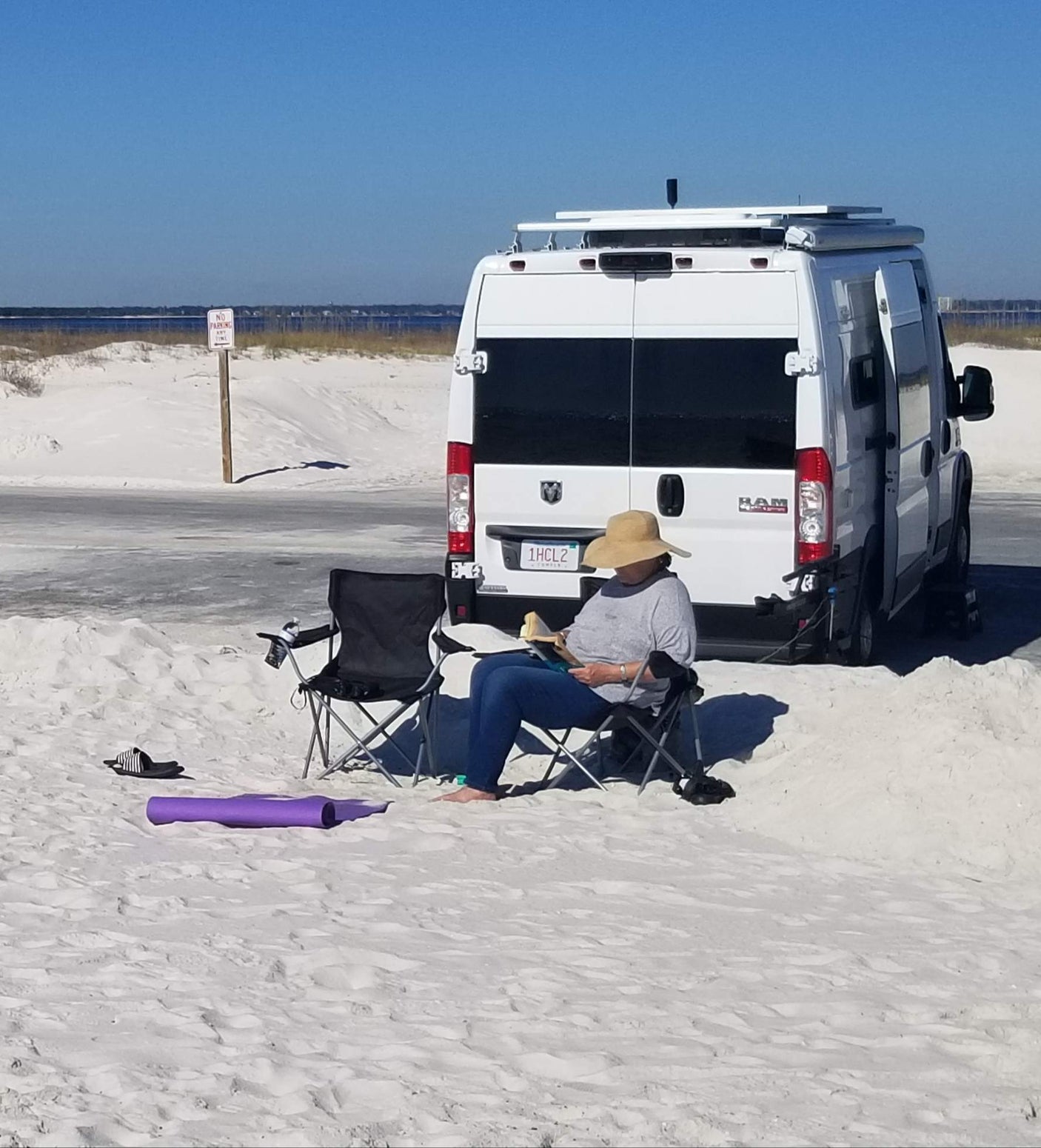 and open sliding door.|White Ram ProMaster camper van