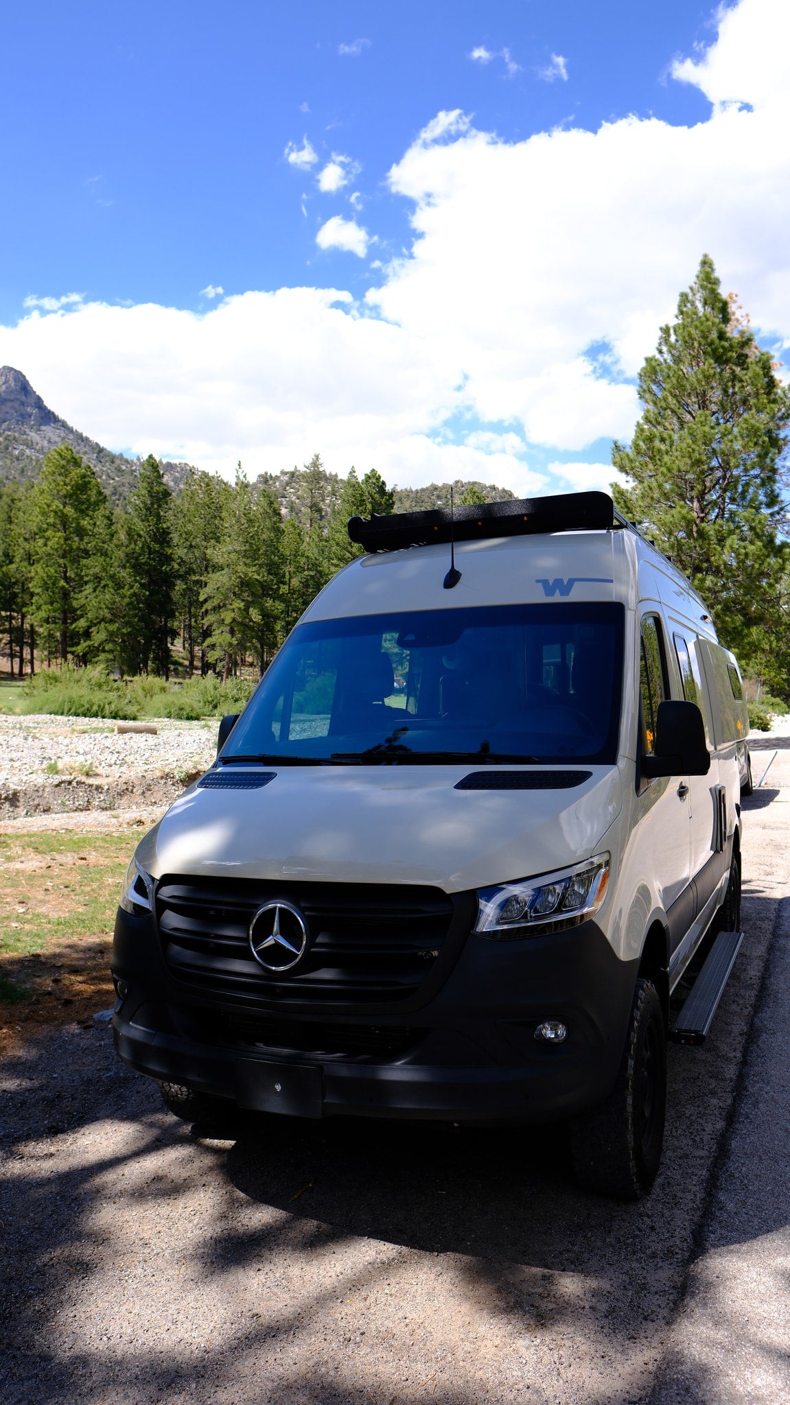 and dinette. Sleeps 3.|A light-colored Mercedes-Benz Sprinter camper van