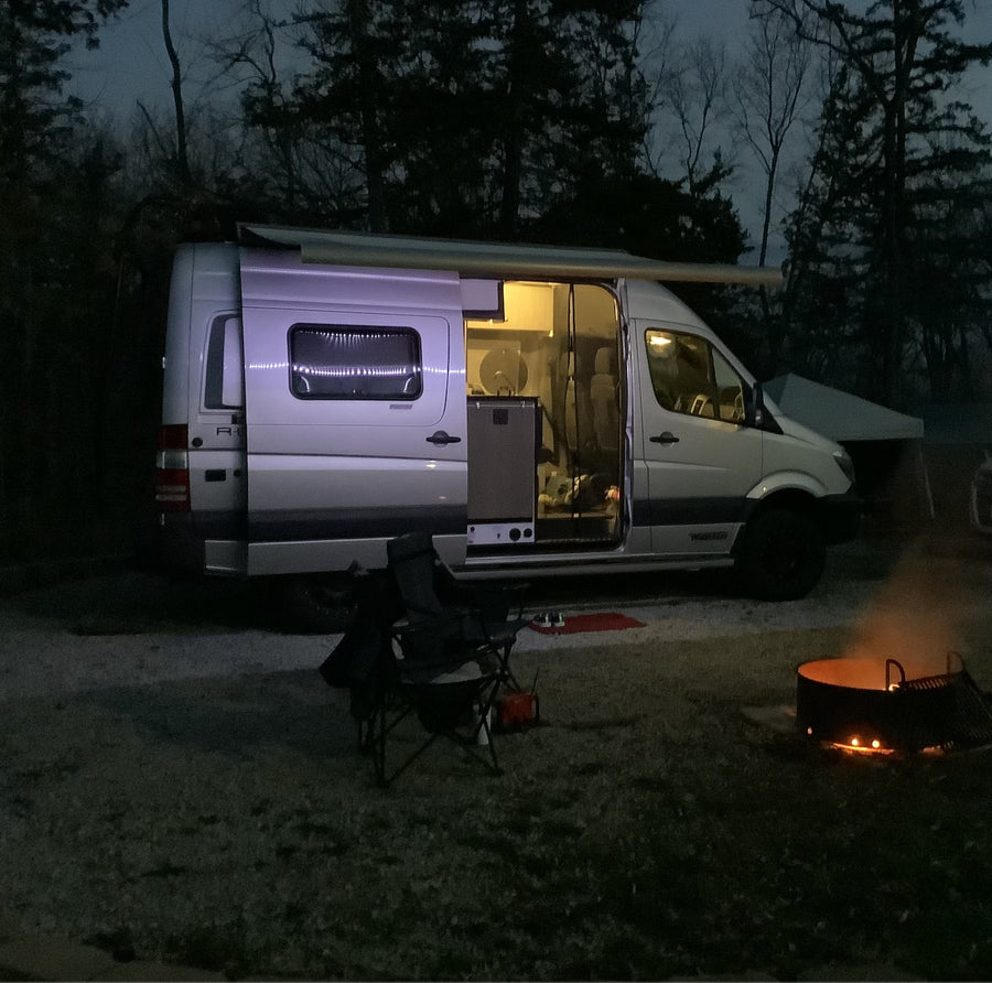 looking towards the front cabin.|Cozy RV rental interior with a charcuterie board