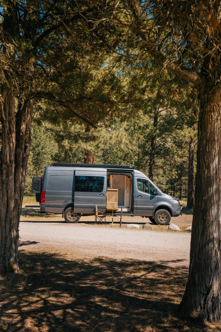 ideal for an RV rental adventure.|Cozy dark grey RV rental with an extended awning and open