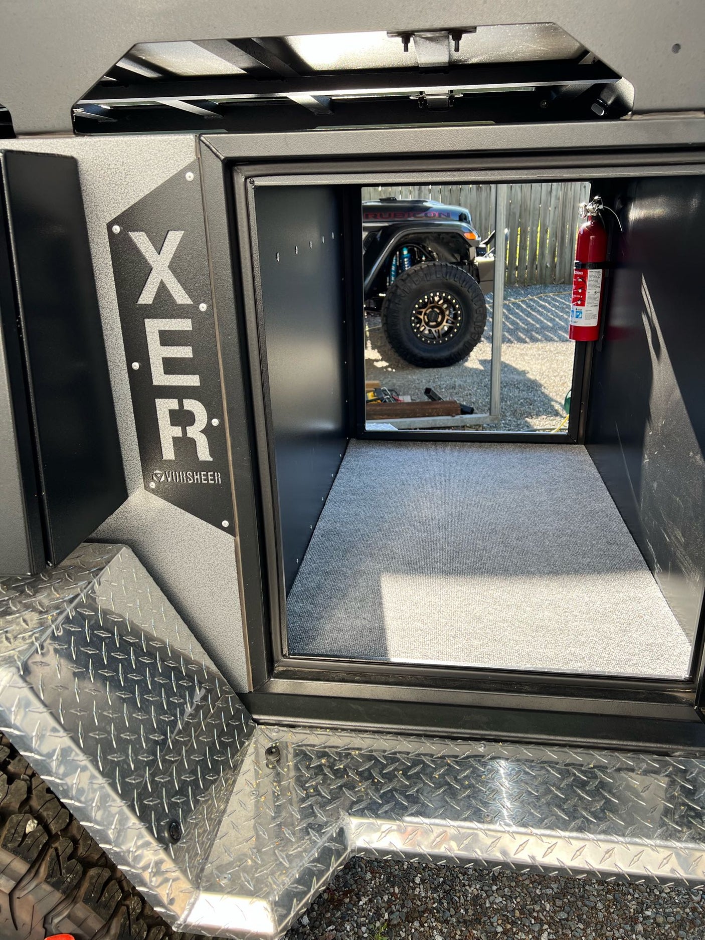 and outdoor kitchen setup.|An rv rental showing a pull-out outdoor kitchen: sink