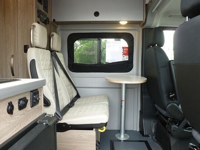 and controls. Ready for your adventures.|Comfortable RV rental interior with spacious bed