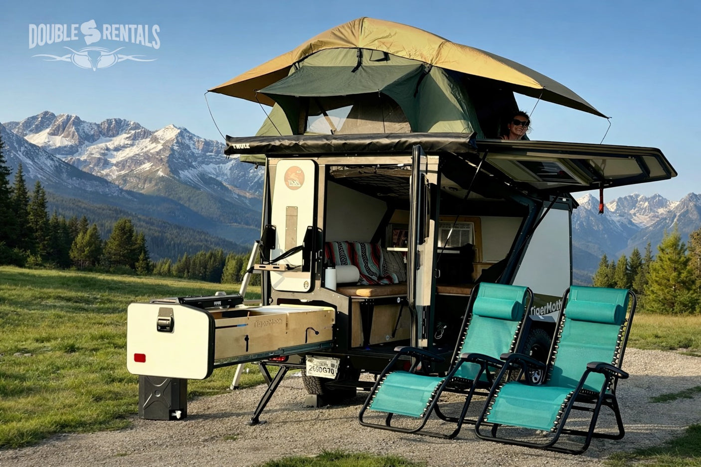 This TigerMoth rv rental, equipped with a rooftop tent & outdoor kitchen, offers stunning mountain views for your next adventure.