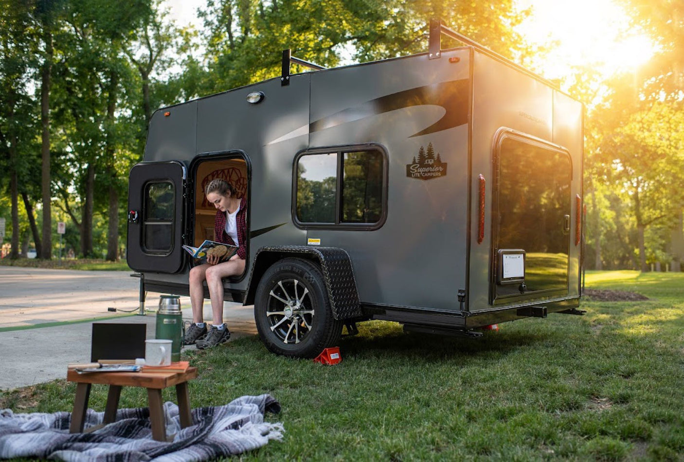bins.|An RV rental's organized kitchenette with a portable stove