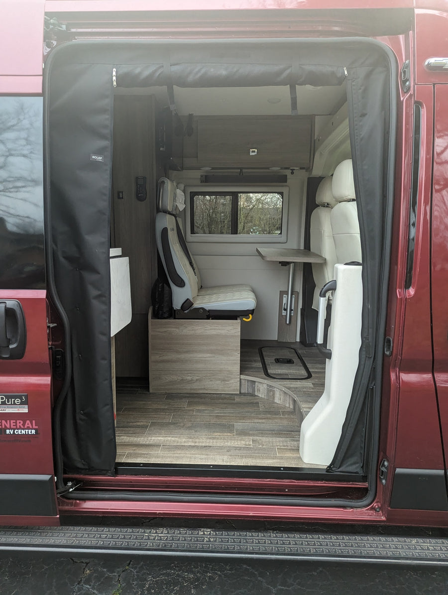 equipped for adventure with a ladder & bike rack. Ideal for an RV rental.|Red van's roof with a Coleman-Mach AC