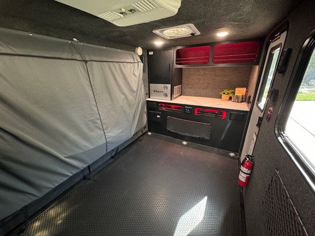 perfect for your next outdoor adventure.|Cozy RV rental interior with pop-out bed — photo 6