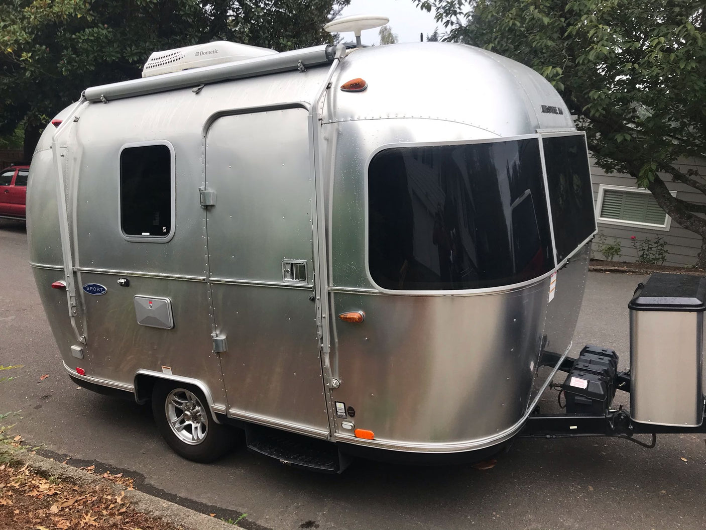 and microwave.|RV rental interior: A modern travel trailer dining area with a white table