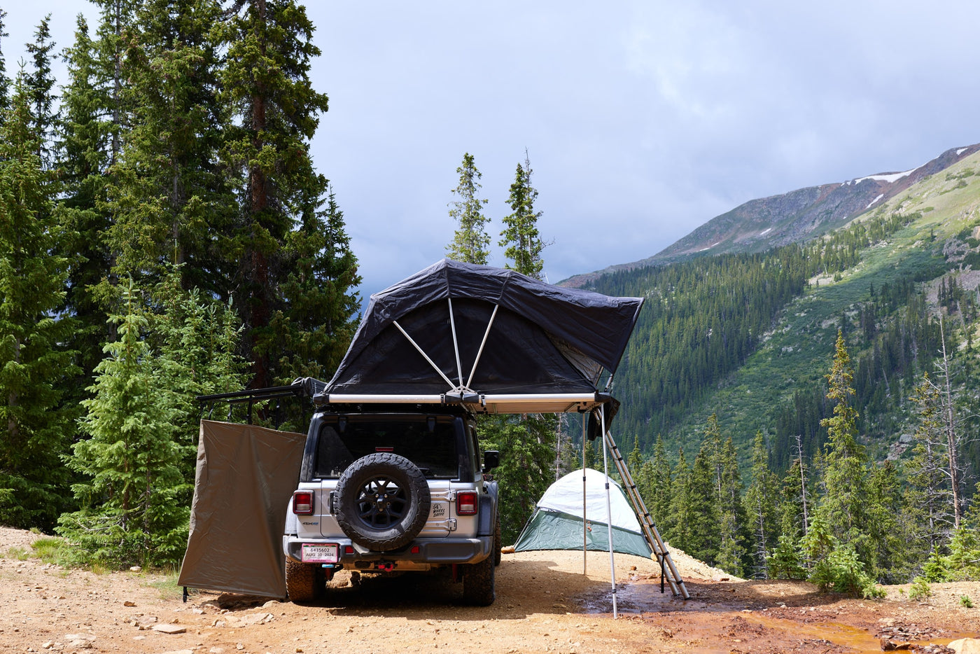 showing its "RENT-RV.CO" branding. An ideal RV rental for outdoor adventures.|An RV rental Jeep Willys — photo 3