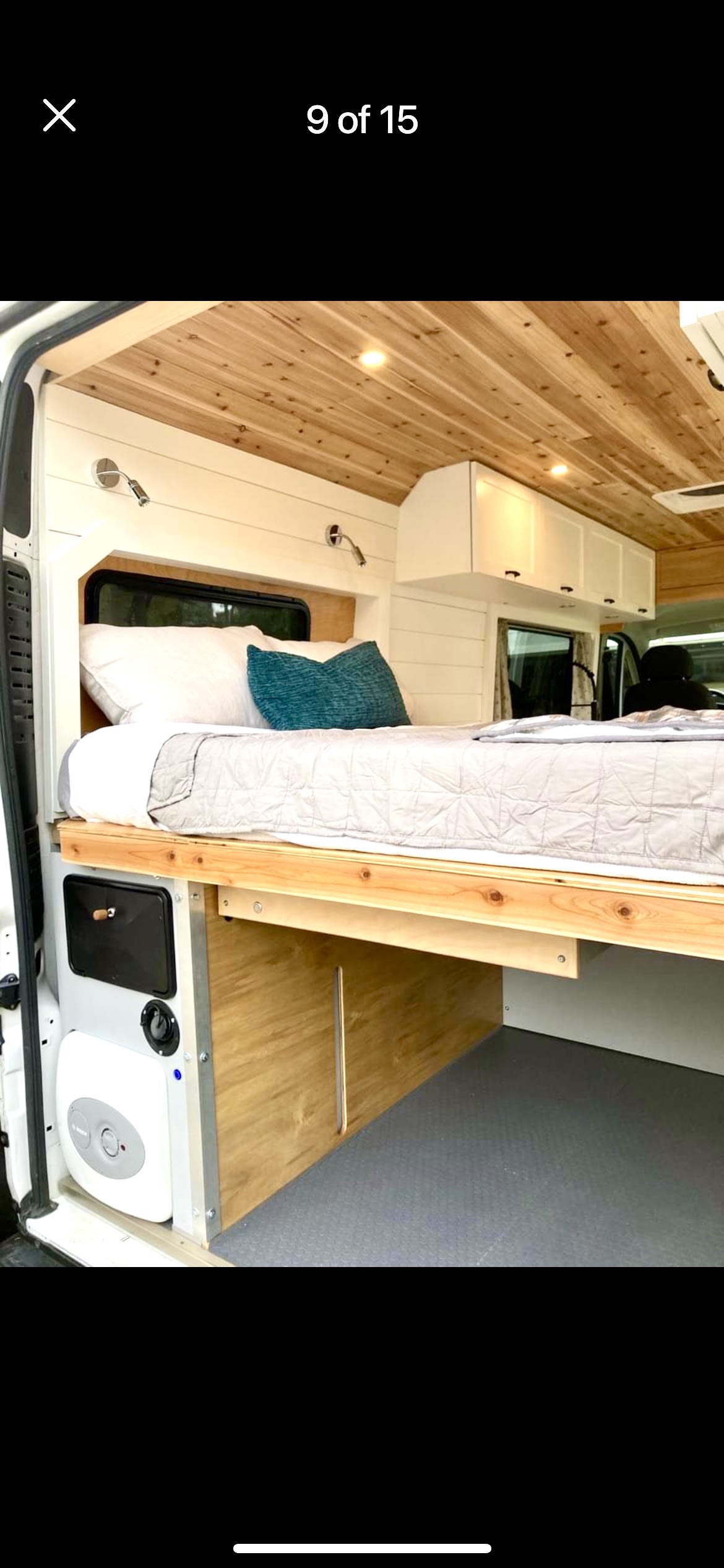 & spacious living area in a camper van.|White Ram ProMaster rv rental van on a paved lot with fallen leaves