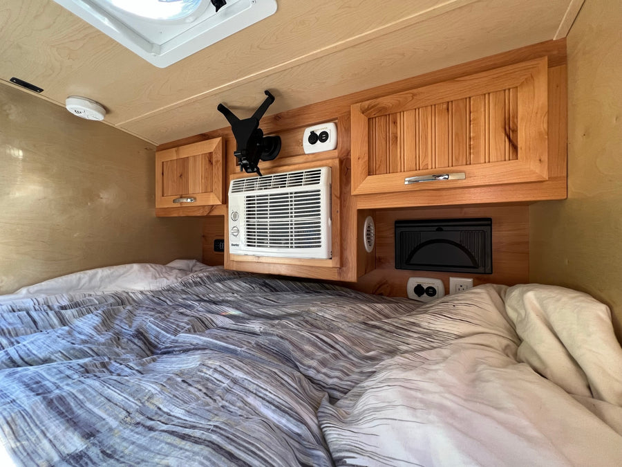featuring a complete rear kitchen for convenient camping.|This RV rental's clever rear galley features a sink
