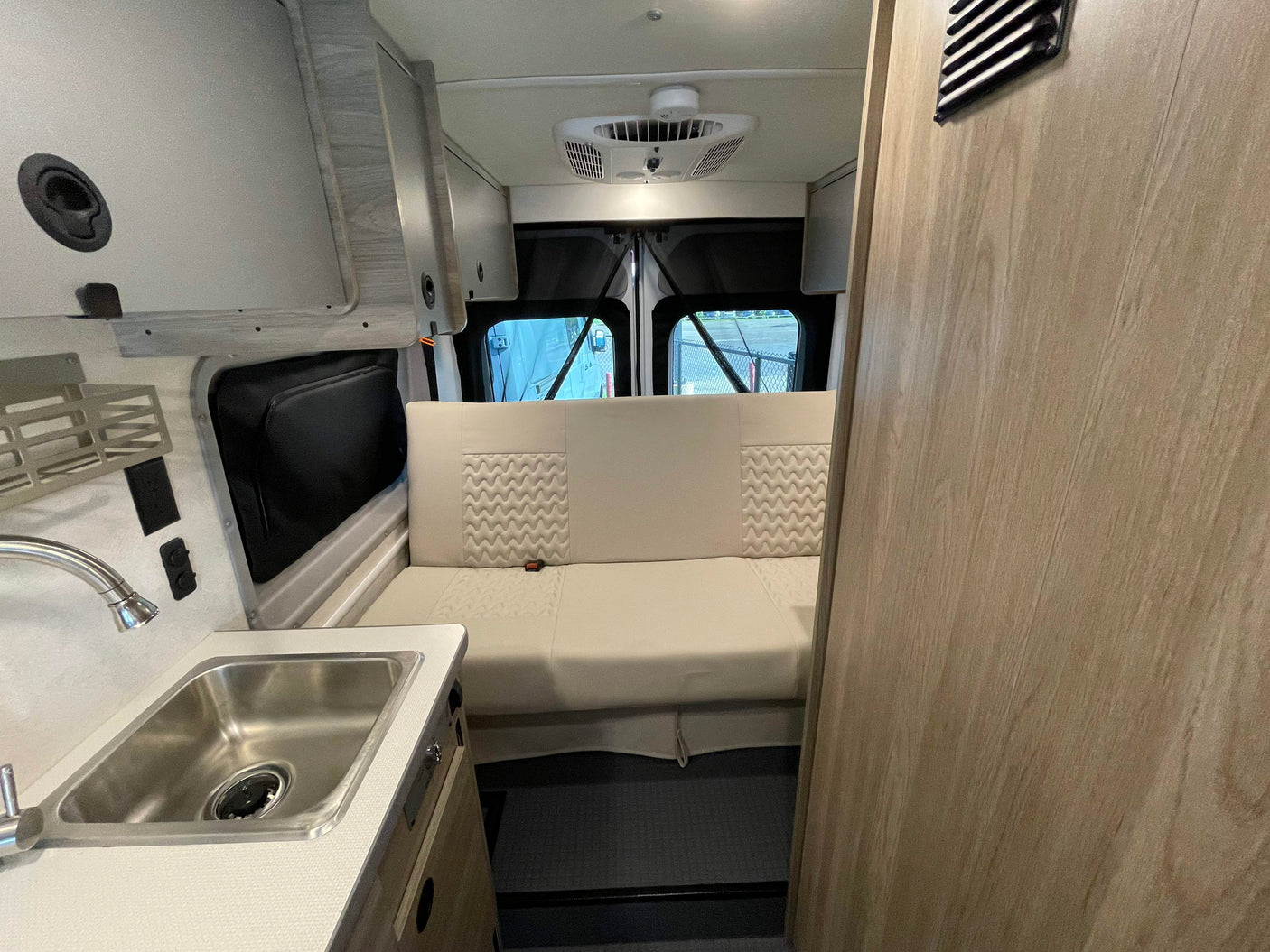 and a Winnebago control panel with solar.|Explore this Winnebago RV rental interior: featuring a kitchenette