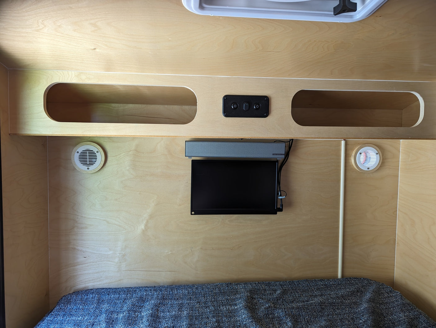 and a power monitor on the door.|Back of a Hiker Trailer RV rental