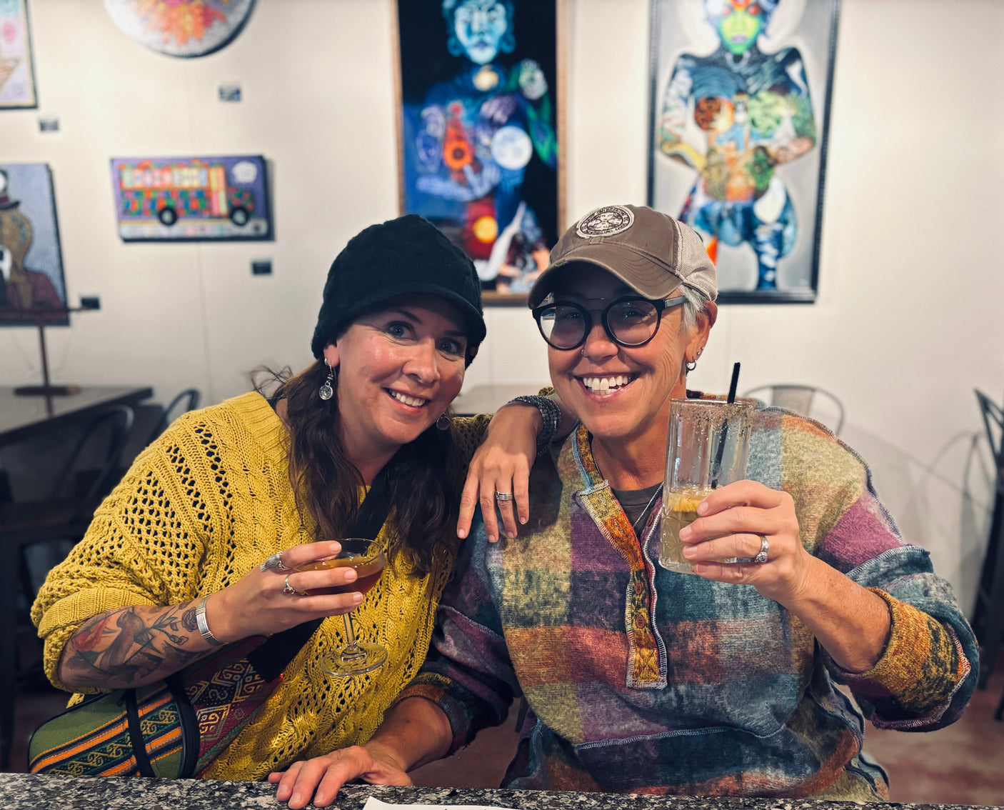 Happy friends enjoying an art gallery visit & drinks, perhaps planning their next fun RV rental adventure!