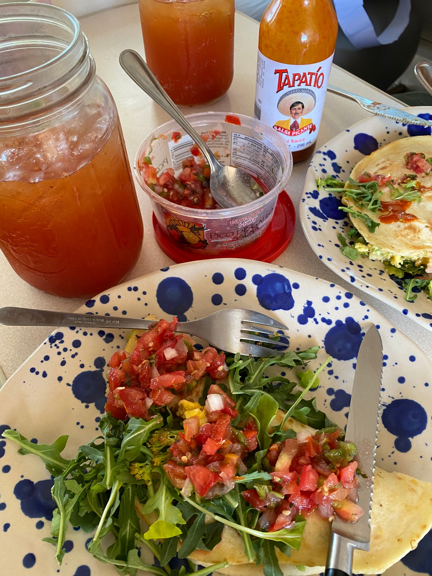 Dig into cheesy quesadillas, fresh pico, and hot sauce with a cold drink. A perfect meal idea for your rv rental trip!