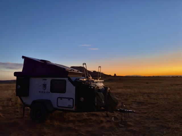 Rugged Mission Overland off-road RV rental, perfect for desert adventures at sunset.