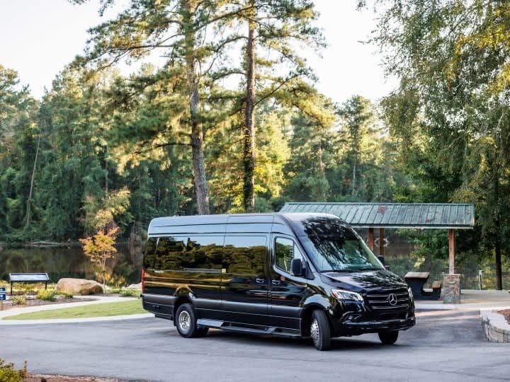 great for an rv rental.|Luxurious RV rental interior with cream leather captain's chairs