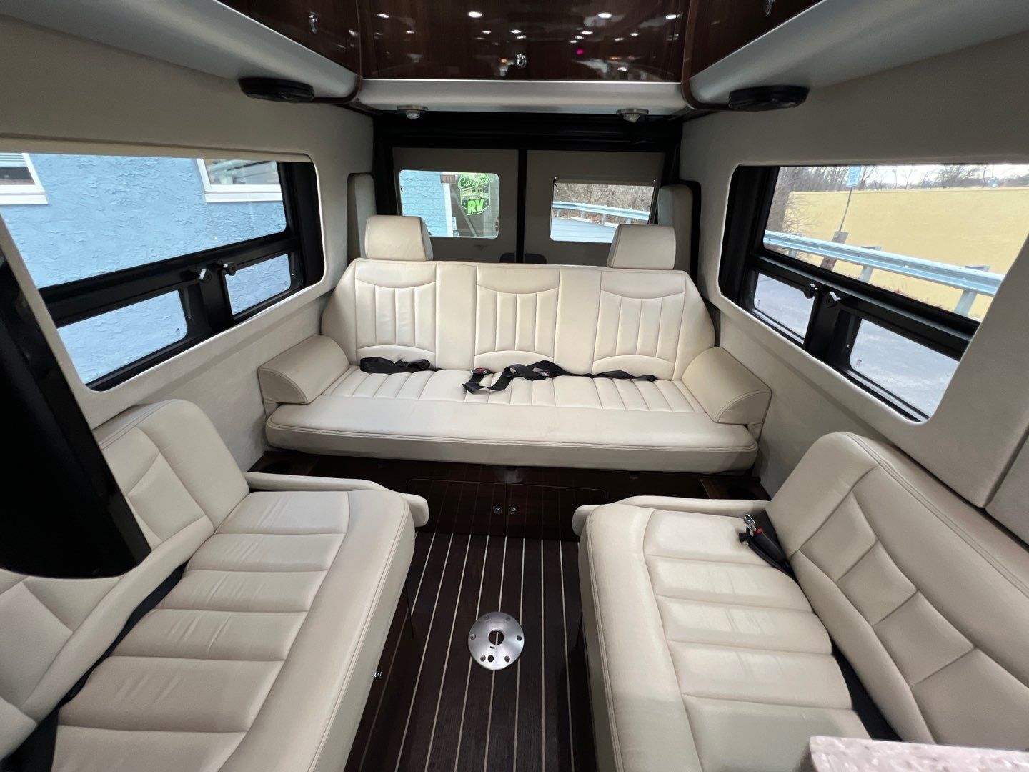 and storage.|Luxurious rv rental interior featuring comfortable cream seating