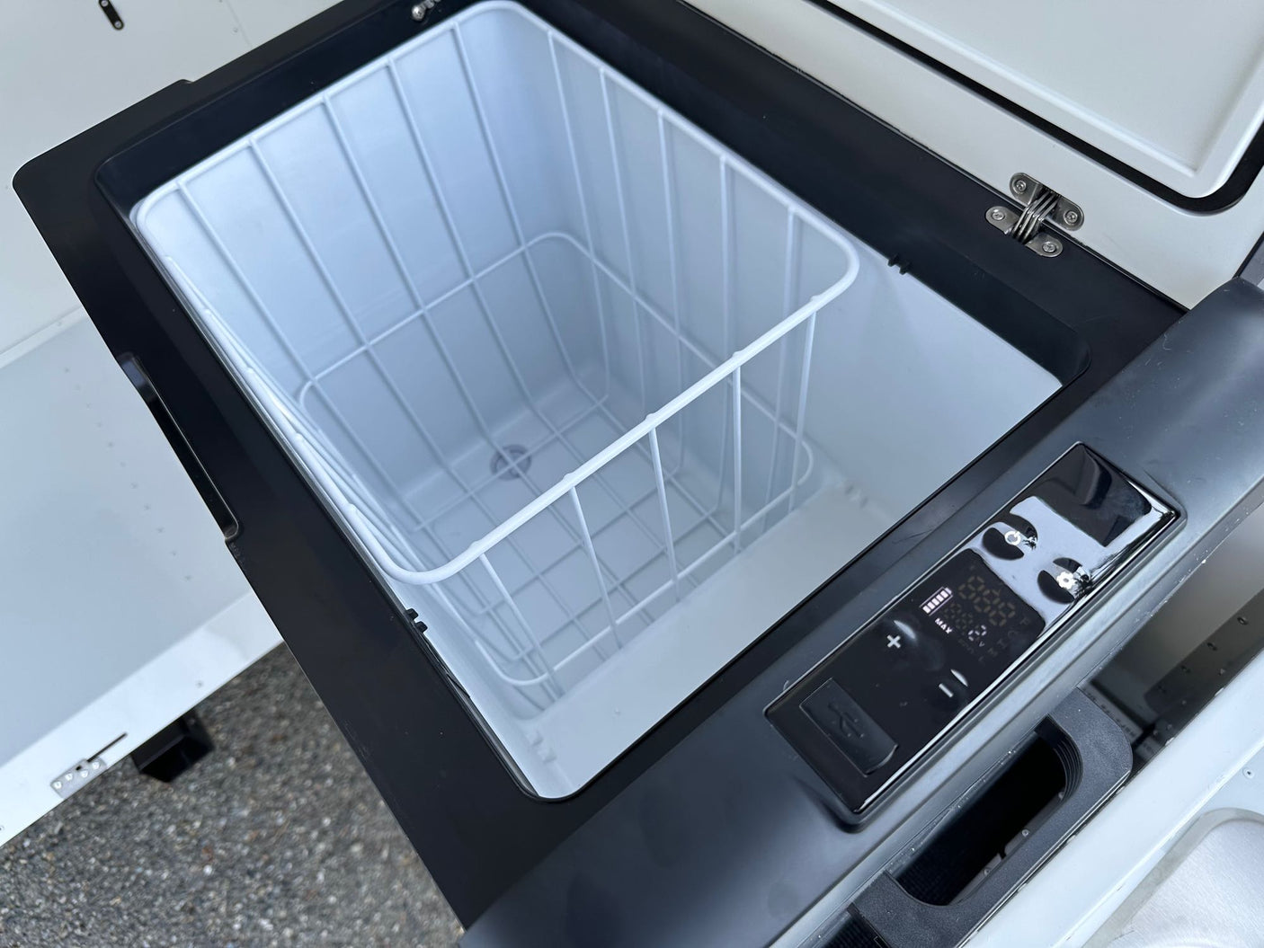 showcasing a cozy RV rental campsite.|This RV rental includes an outdoor kitchen unit: a sink with faucet