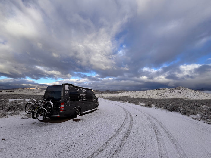 set against snow-capped mountains for a mountain adventure.|Feet up