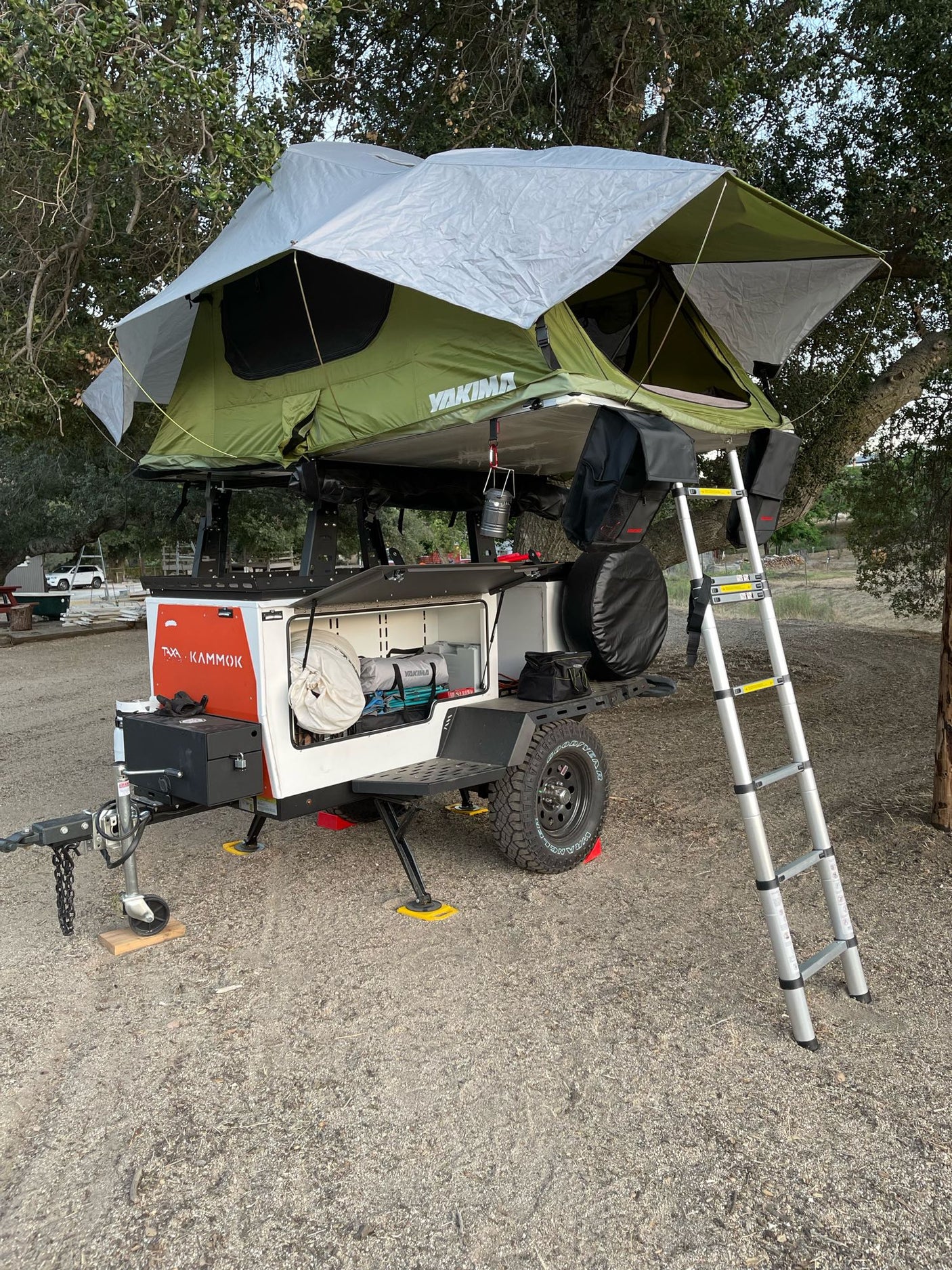 Adventure-ready rv rental: An off-road overland trailer with a Yakima rooftop tent, perfect for your next camping trip.