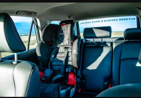 'TRD' headrests. Wide view of rolling hills outside. Ideal adventure vehicle for your next rv rental getaway.|Driver's view in an rv rental: steering wheel