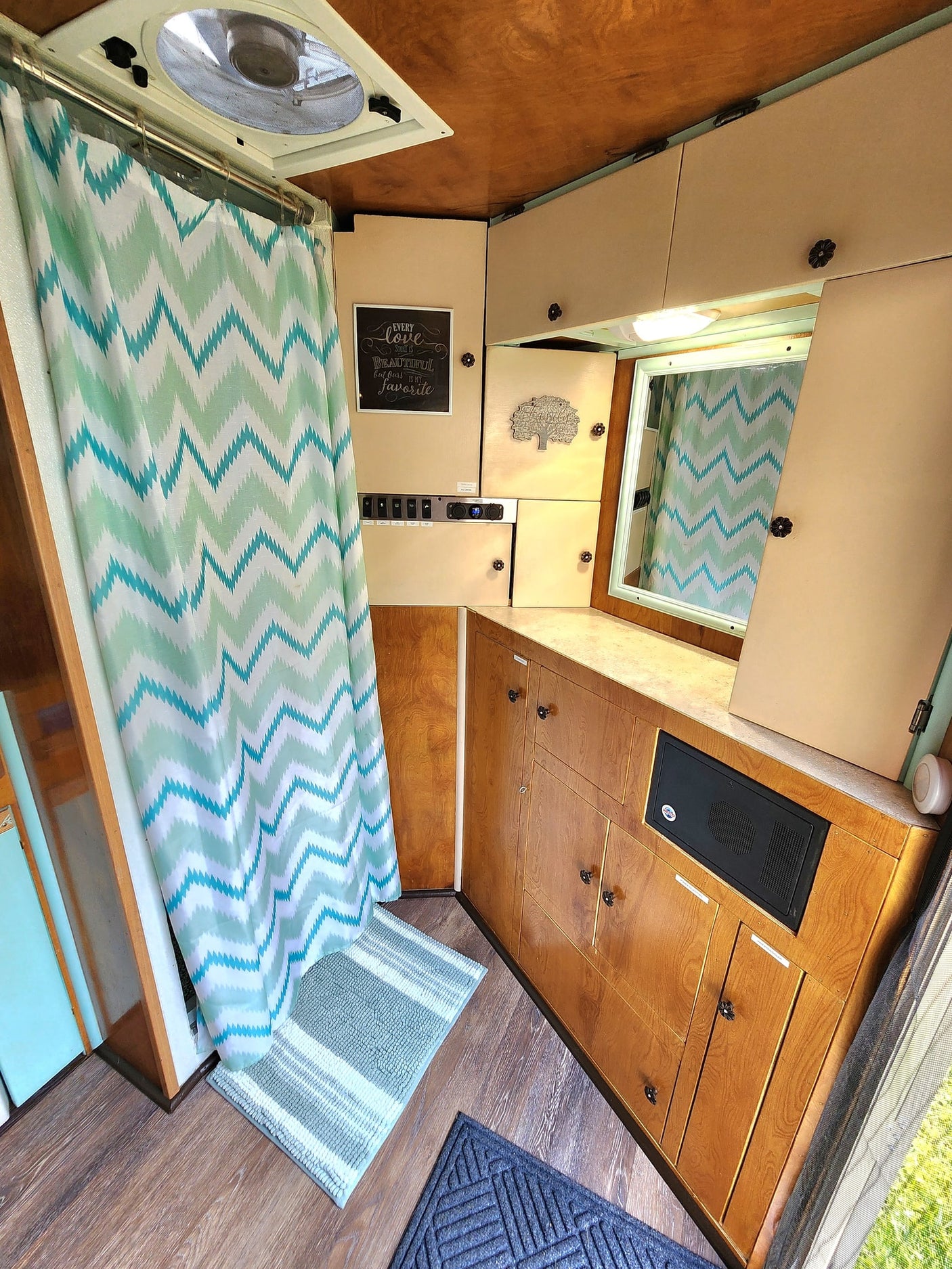 & outdoor gear.|Cozy RV rental interior featuring a bed