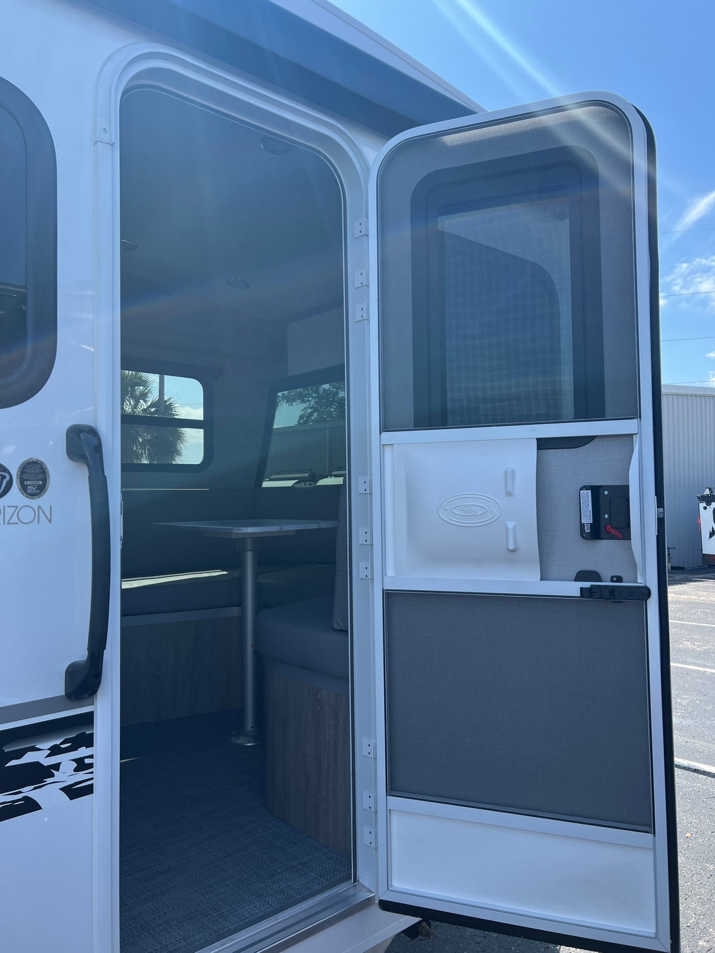 white and black travel trailer. This modern RV