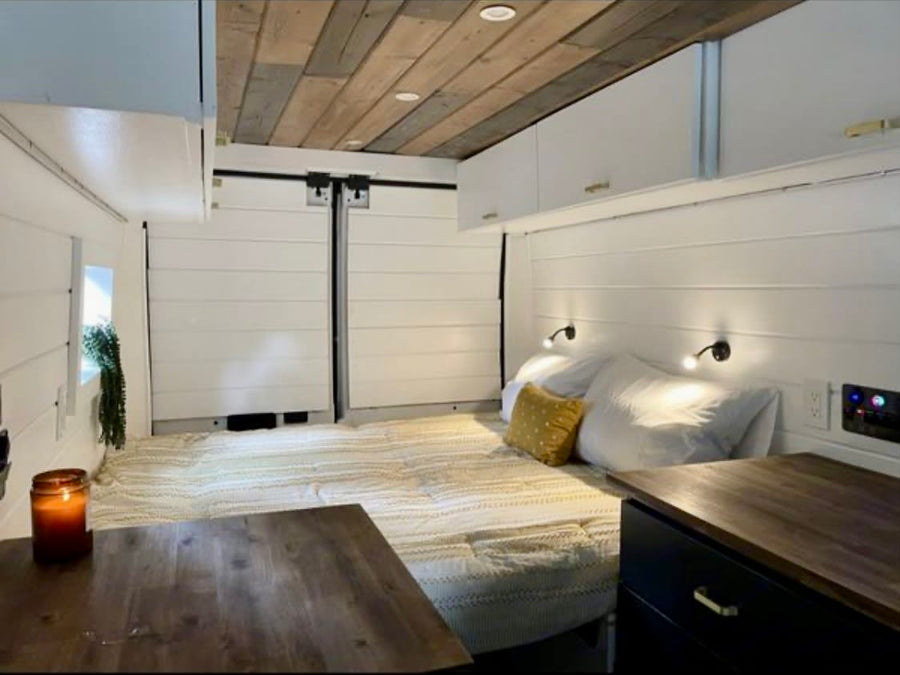 and a dining table.|Bright RV rental interior featuring a wood ceiling