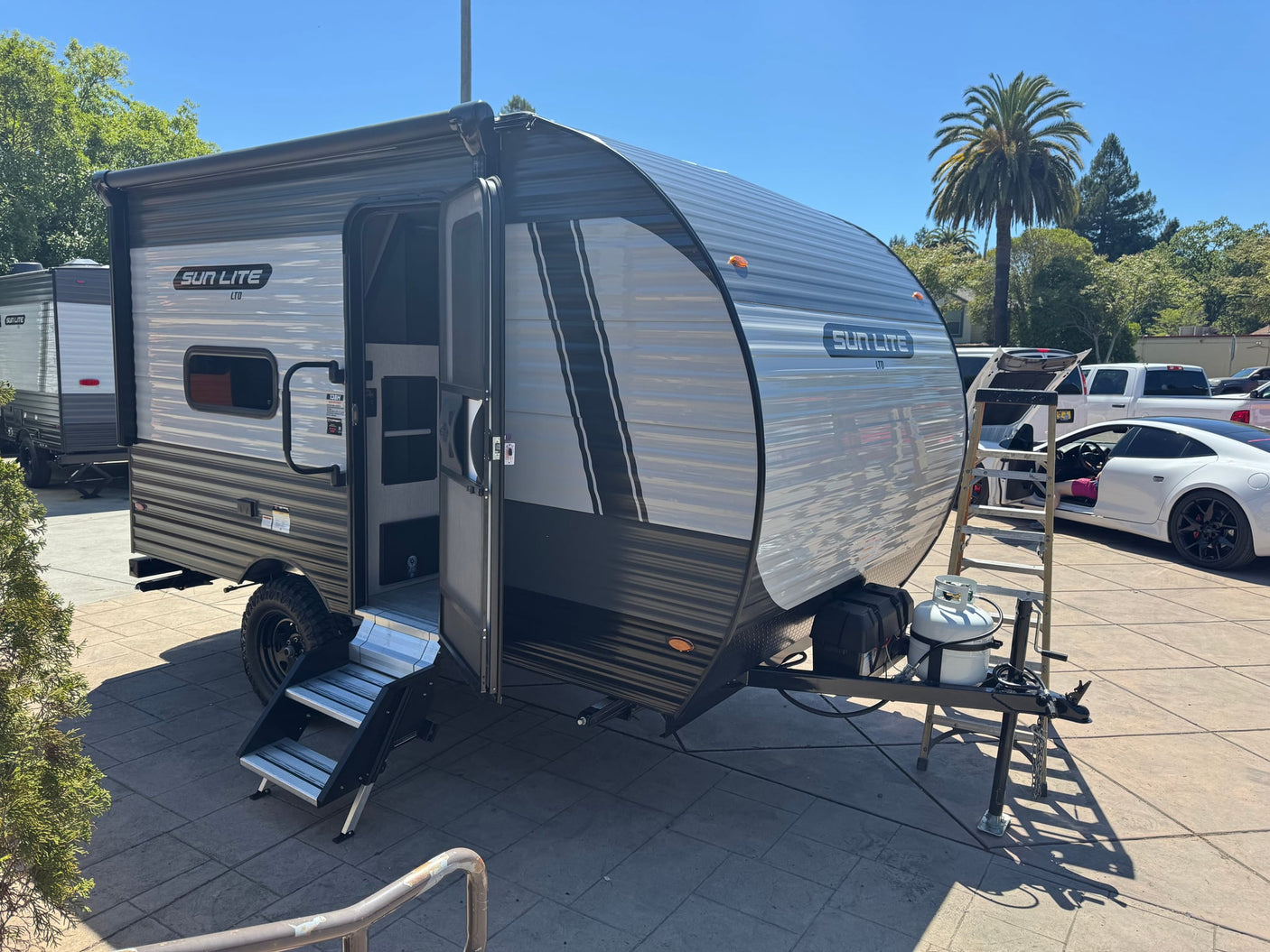 A compact Sun Lite travel trailer