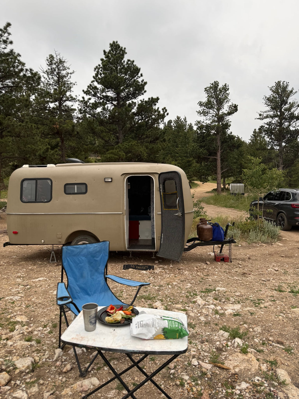 and window view.|Cozy RV rental interior with a bed — photo 7