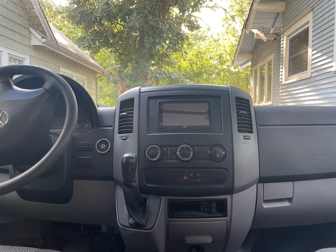 secured in an RV rental van interior. Ready for travel.|Spacious RV rental interior with a compact kitchen