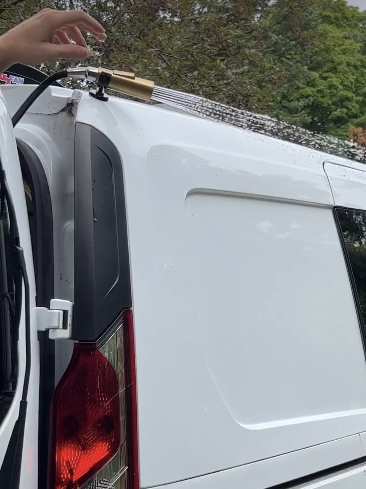 and a portable JBL speaker.|A white RV rental van parked on a scenic mountain road with misty — photo 6