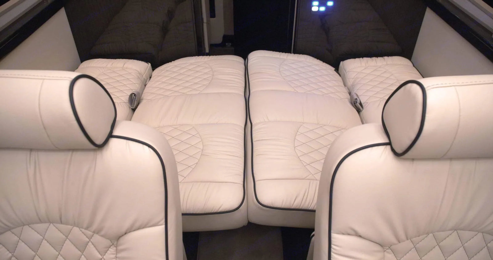and entertainment system. Perfect for travel comfort.|Luxury RV rental interior featuring spacious