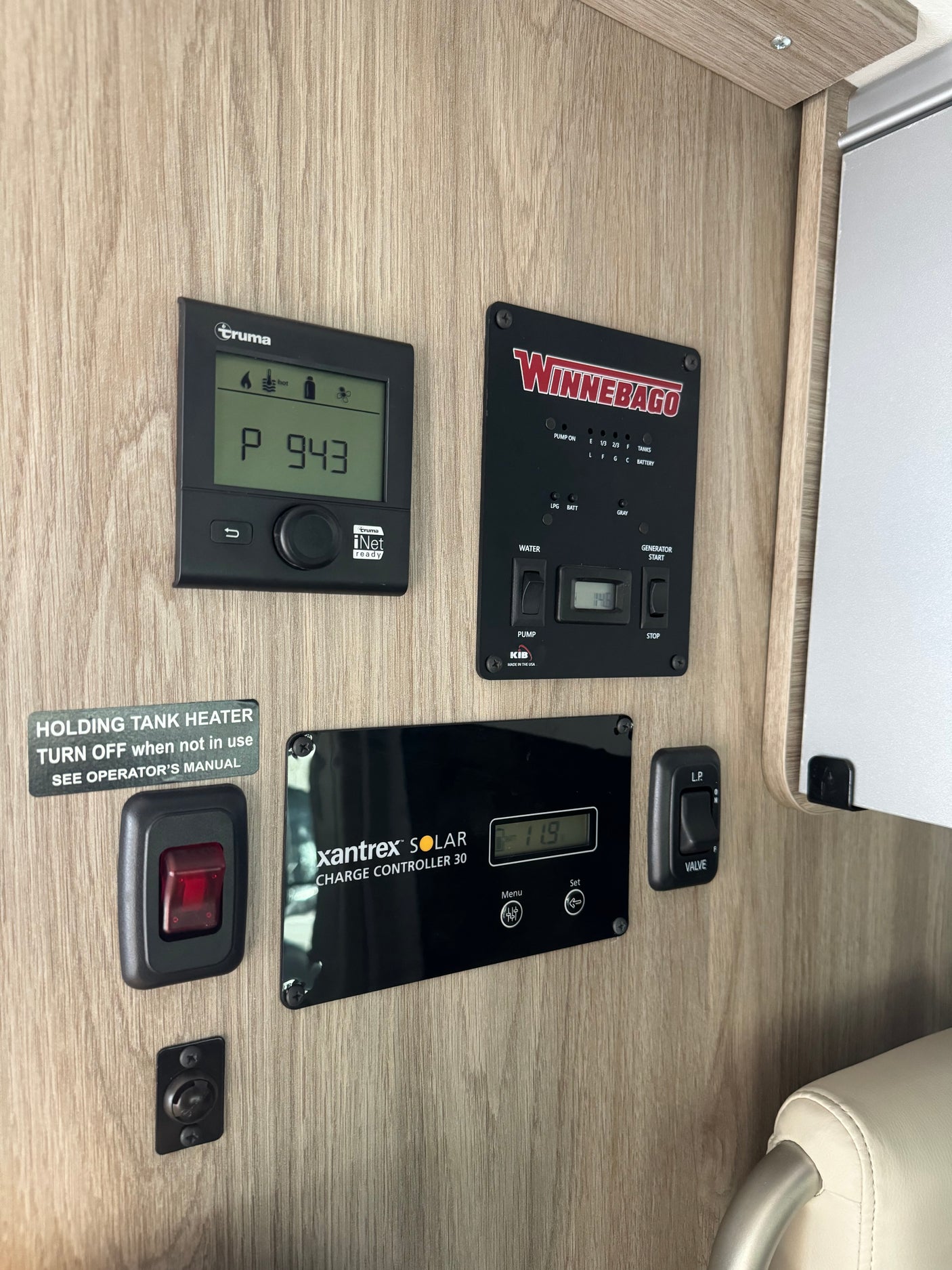RV rental control panel: Truma, Winnebago, and Xantrex displays, plus tank heater & LP valve switches.