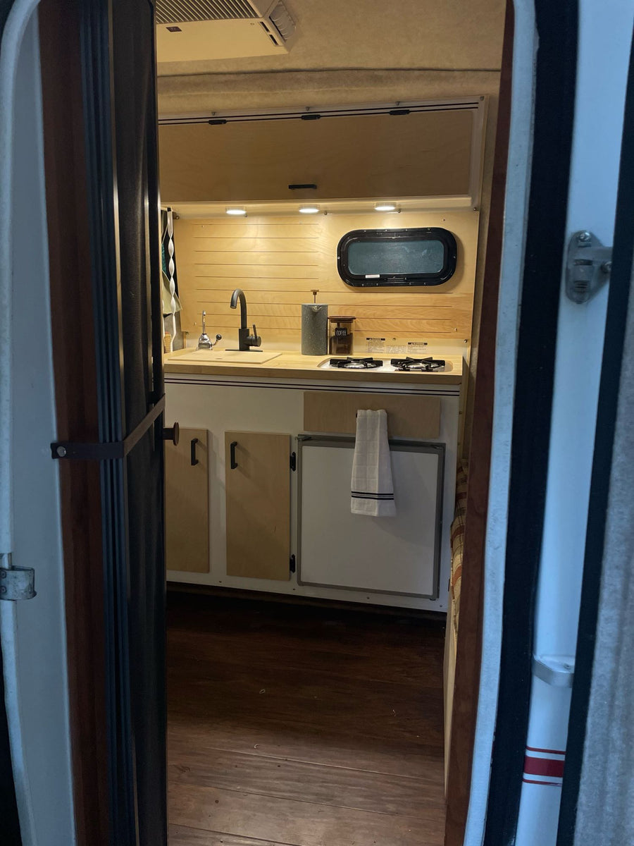and flowers for a peaceful outdoor escape.|Inside a bright RV rental