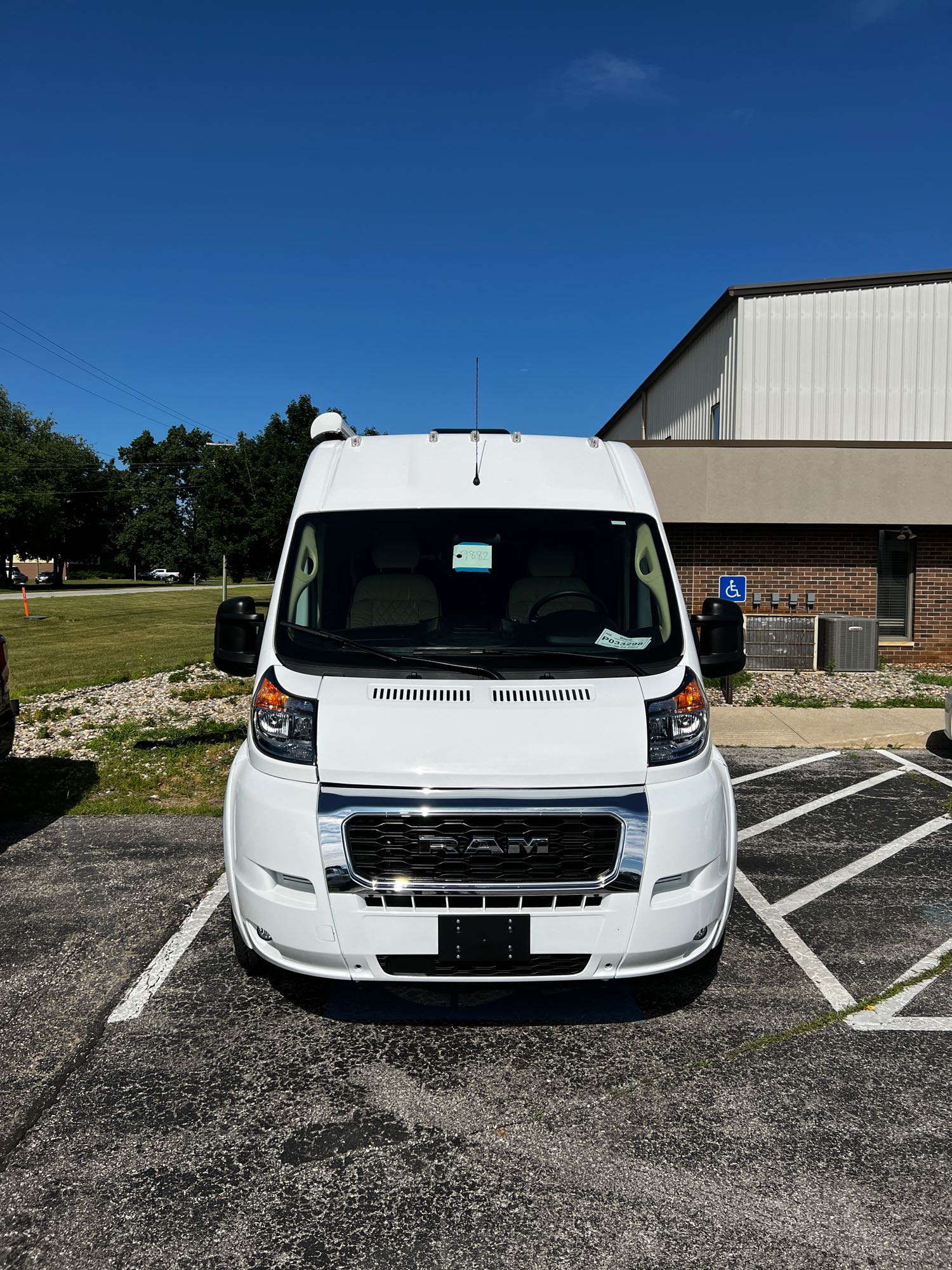 showing spacious shelves & freezer. Ready for your trip's provisions.|RV rental interior: compact kitchen with microwave