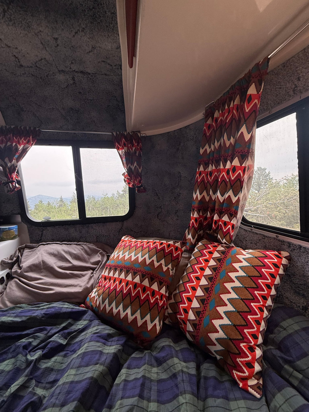showcasing a comfy bed with plaid comforter — photo 5