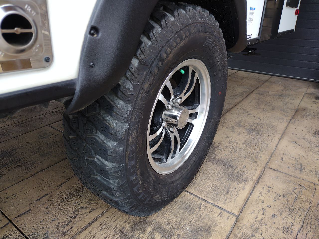 is ready for an RV rental.|RV rental: Close-up of a durable tire with a distinctive silver wheel and black fender flare