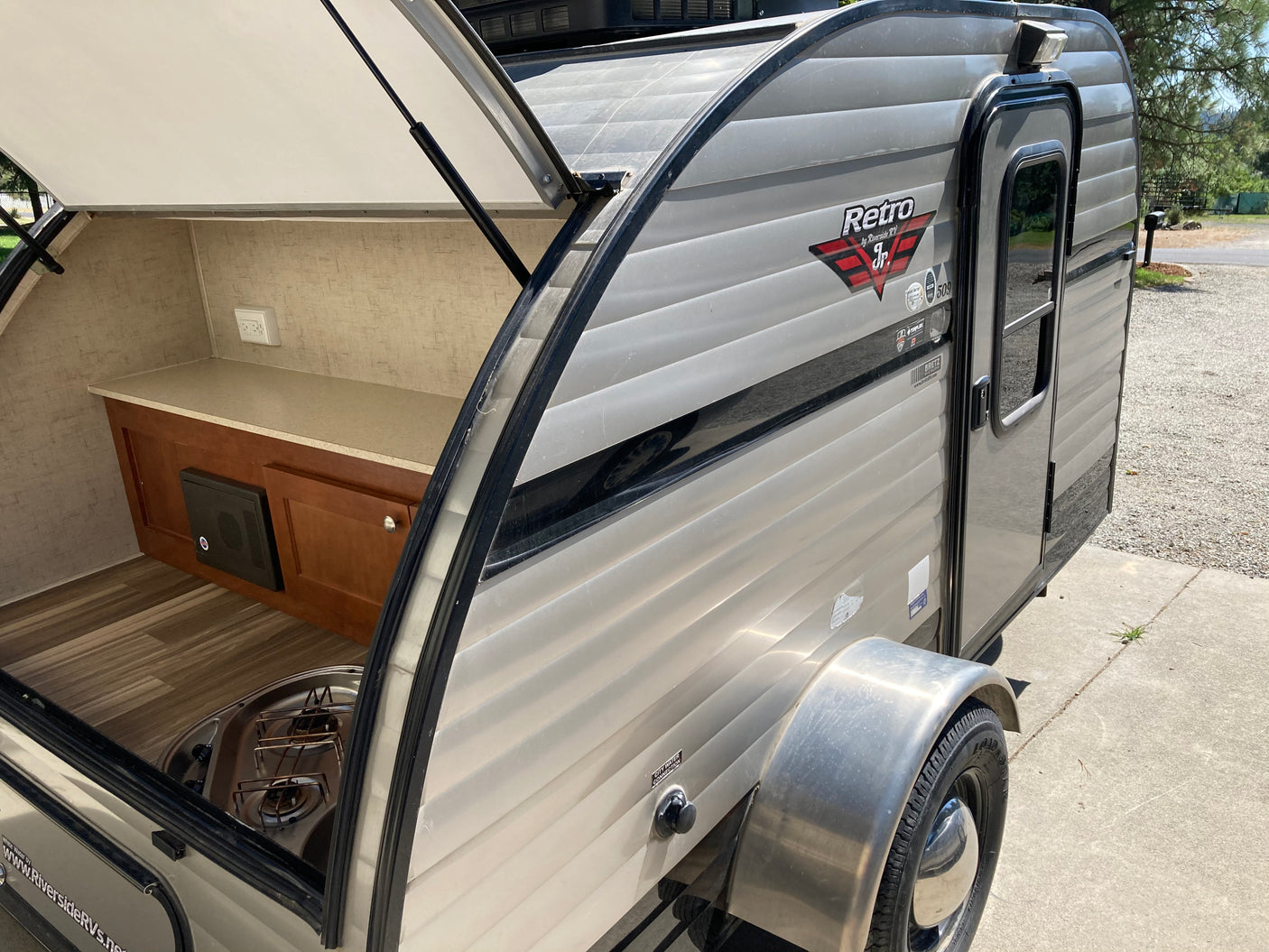 Open rear galley of a gray Retro Jr. teardrop travel trailer. Ideal for your next rv rental adventure.