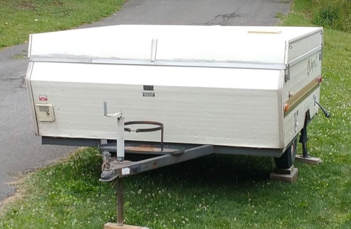 empty compact mini-fridge in an RV rental