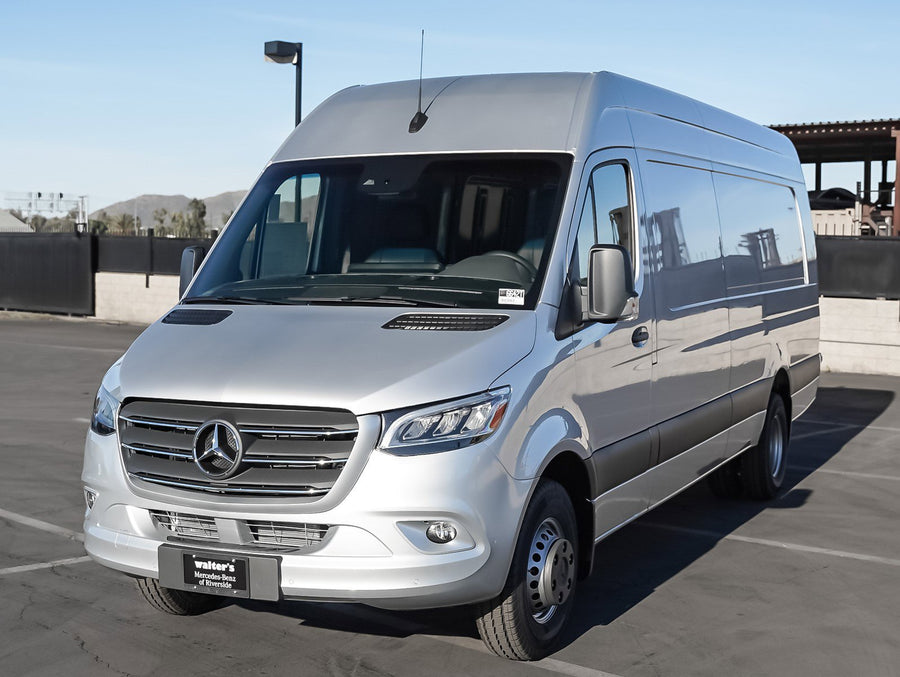 A silver Mercedes-Benz Sprinter van
