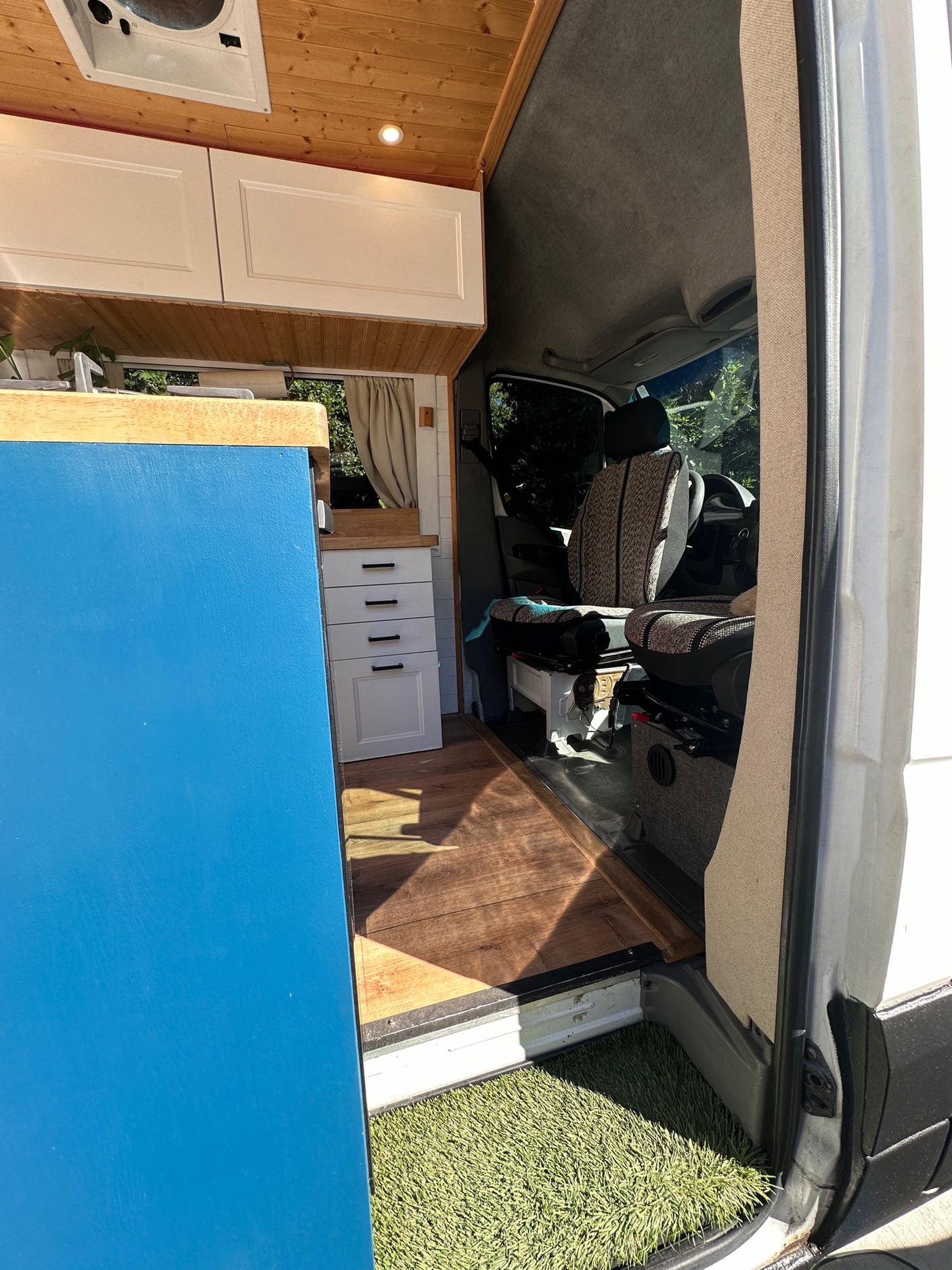 ideal for adventurers.|A well-equipped RV rental interior with a compact kitchen