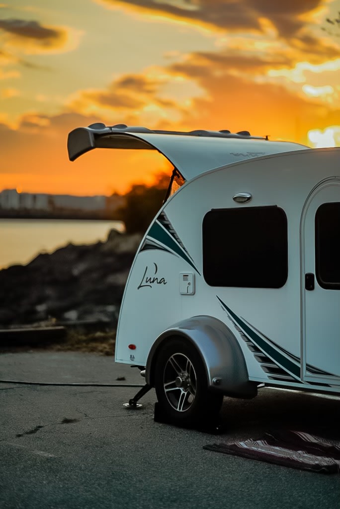 ideal for an unforgettable rv rental trip.|White Luna tear-drop RV rental for tiny camping