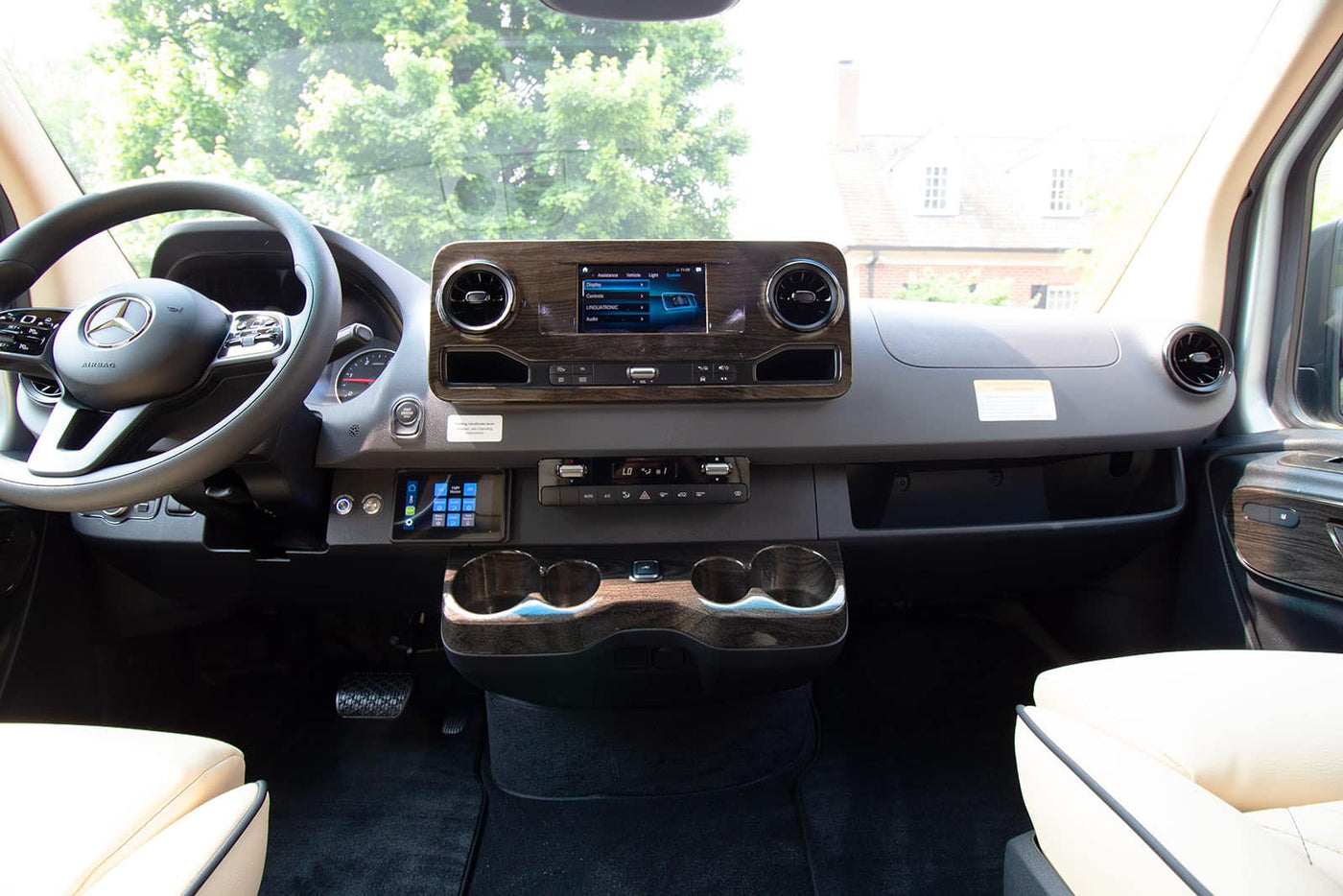and the front cabin view.|Stunning coastal view from a comfortable RV rental. Enjoy scenic ocean vistas and luxury travel.|Luxury RV rental interior with plush seating — photo 9