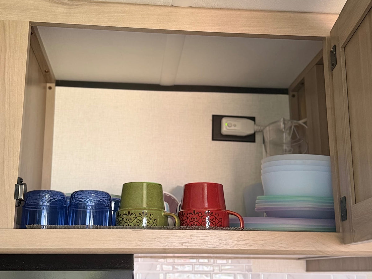 and an innoflame unit.|RV rental bedroom: Features a neatly made bed — photo 7
