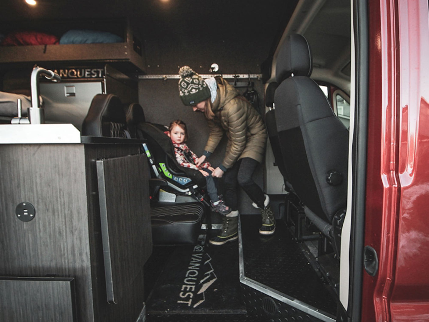 and a hidden toilet.|Explore with an RV rental: Van interior with sink