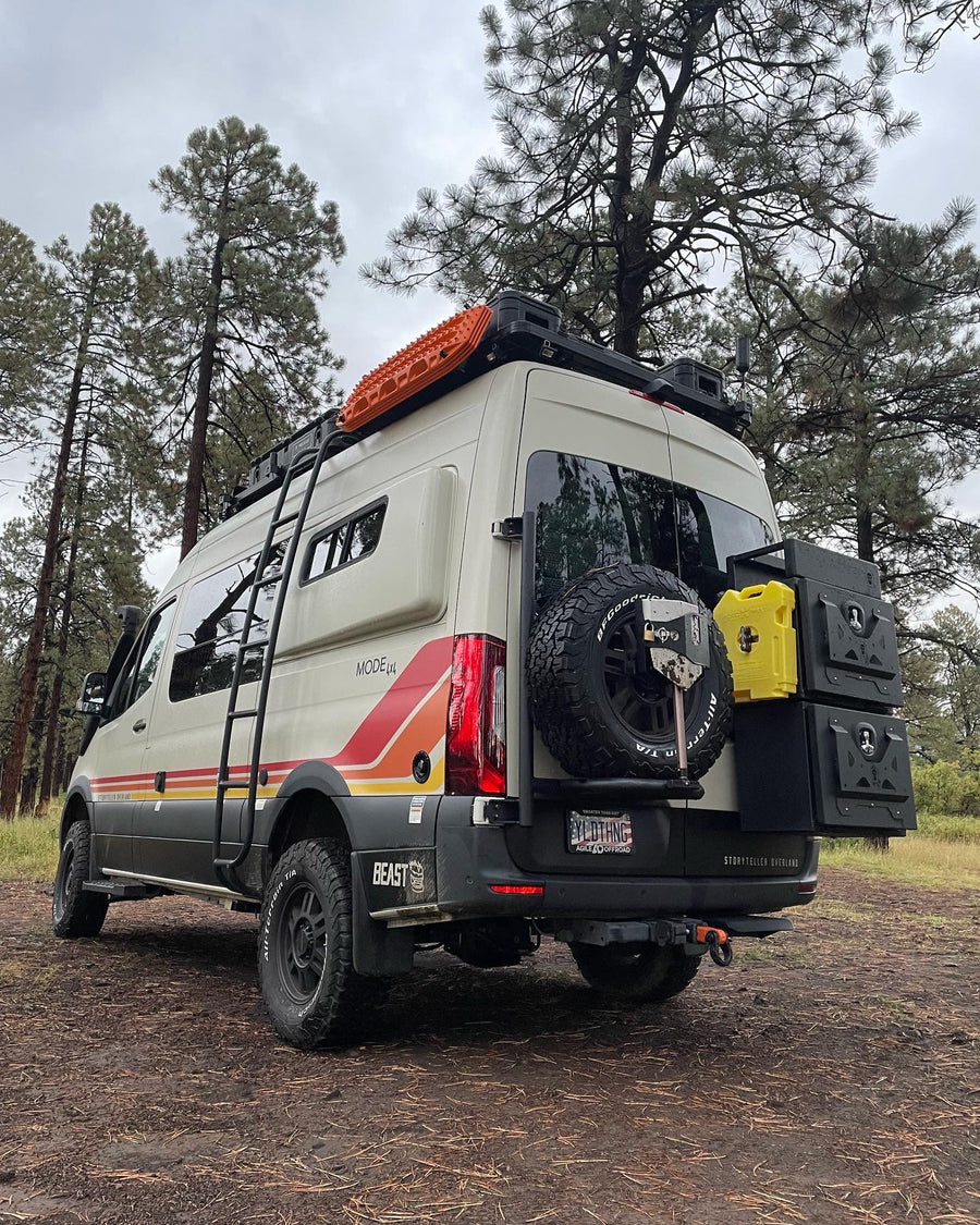 This Storyteller Overland Mode 4x4 adventure van, an ideal rv rental, is equipped for off-road journeys through the pines.