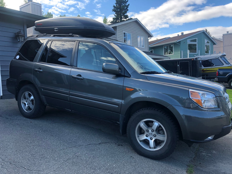 Gray SUV with roof cargo box