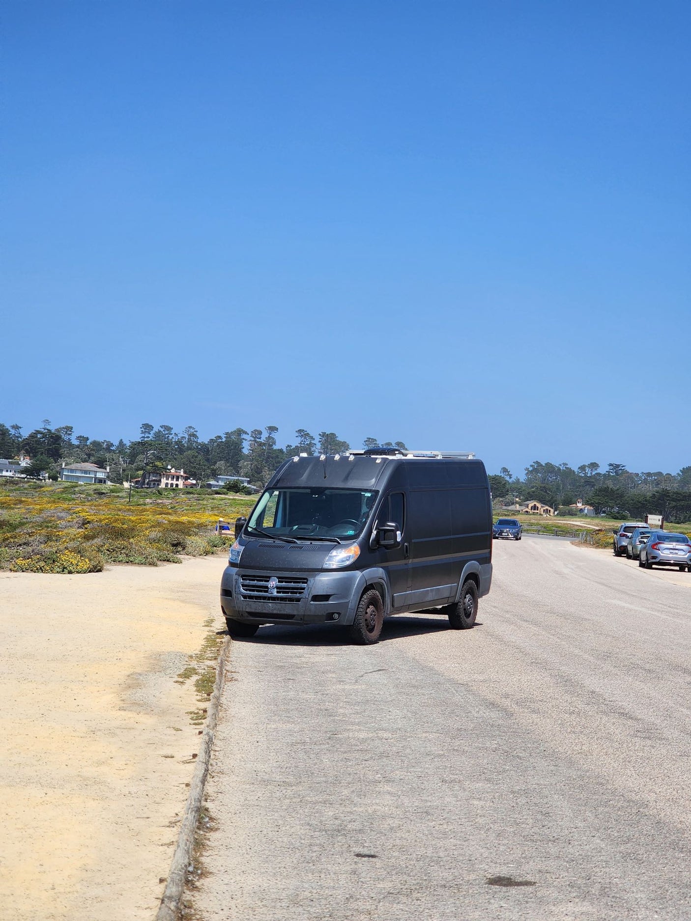 and wood counter. Green landscape outside.|This RV rental features a cozy living area with air plants