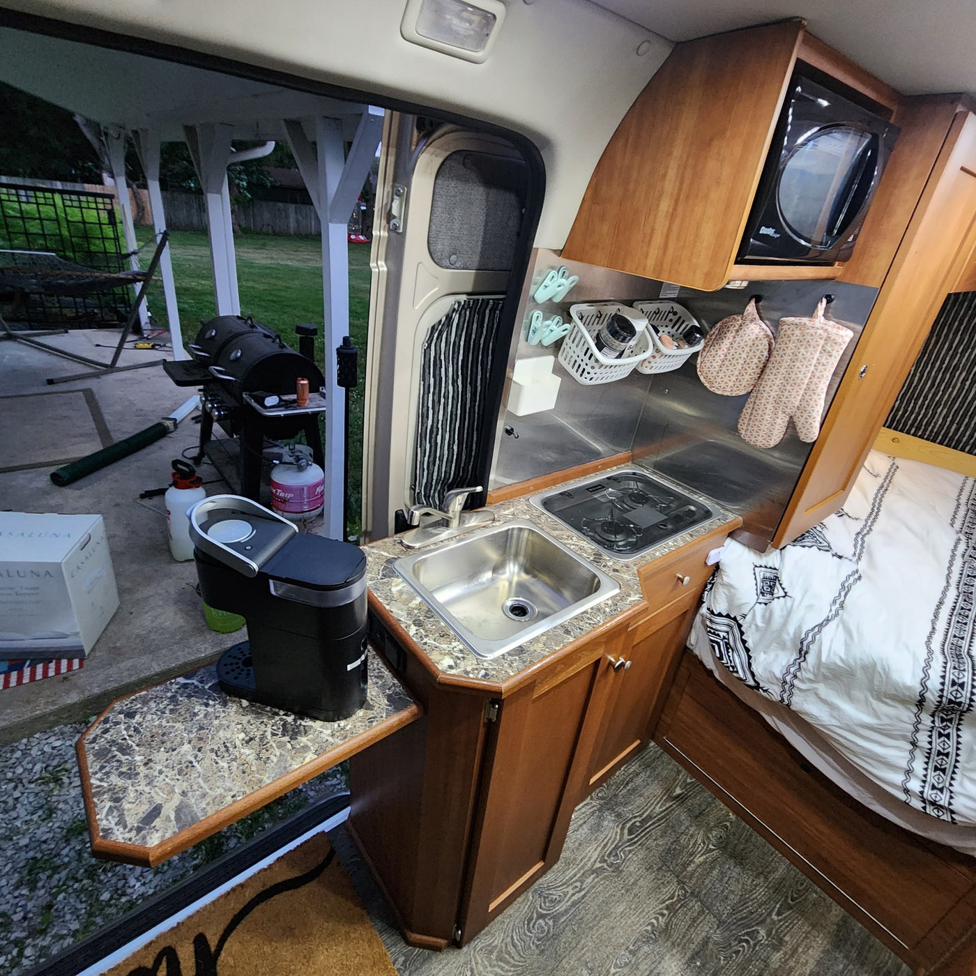 and bed/lounge area floor plan for easy travel.|RV rental interior: front swivel seats — photo 8